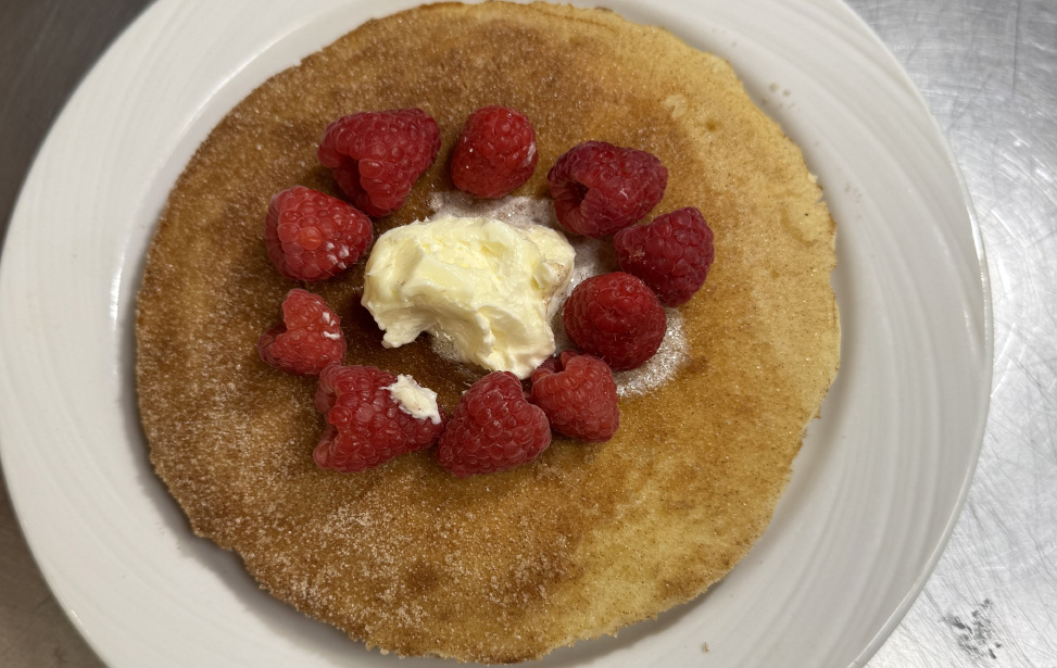 Churro pancakes with raspberries